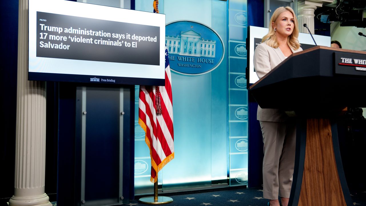 WASHINGTON, DC - APRIL 1: A display reads "Trump istration says it deported 17 more 'violent criminals' to El Salvador" as White House press secretary Karoline Leavitt speaks during the daily press briefing in the Brady Press Briefing Room at the White House on April 1, 2025 in Washington, DC. Leavitt discussed tomorrow's expected "Liberation Day" tariffs g Rose Garden event by U.S. President Donald Trump, illegal crossings at the southern border, deportations, the Mara Salvatrucha gang commonly known as MS-13, and other topics. (Photo by Andrew Harnik/Getty Images)