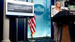 WASHINGTON, DC - APRIL 1: A display reads "Trump istration says it deported 17 more 'violent criminals' to El Salvador" as White House press secretary Karoline Leavitt speaks during the daily press briefing in the Brady Press Briefing Room at the White House on April 1, 2025 in Washington, DC. Leavitt discussed tomorrow's expected "Liberation Day" tariffs g Rose Garden event by U.S. President Donald Trump, illegal crossings at the southern border, deportations, the Mara Salvatrucha gang commonly known as MS-13, and other topics. (Photo by Andrew Harnik/Getty Images)