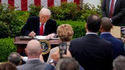 US President Donald Trump signs an executive order during a tariff announcement in the Rose Garden of the White House in Washington, DC, US, on Wednesday, April 2, 2025. Trump plans to roll out tariffs on global trading partners, the centerpiece of his effort to bring back manufacturing to the US and reshape a world trade system he has long decried as unfair. Photographer: Kent Nishimura/Bloomberg via Getty Images