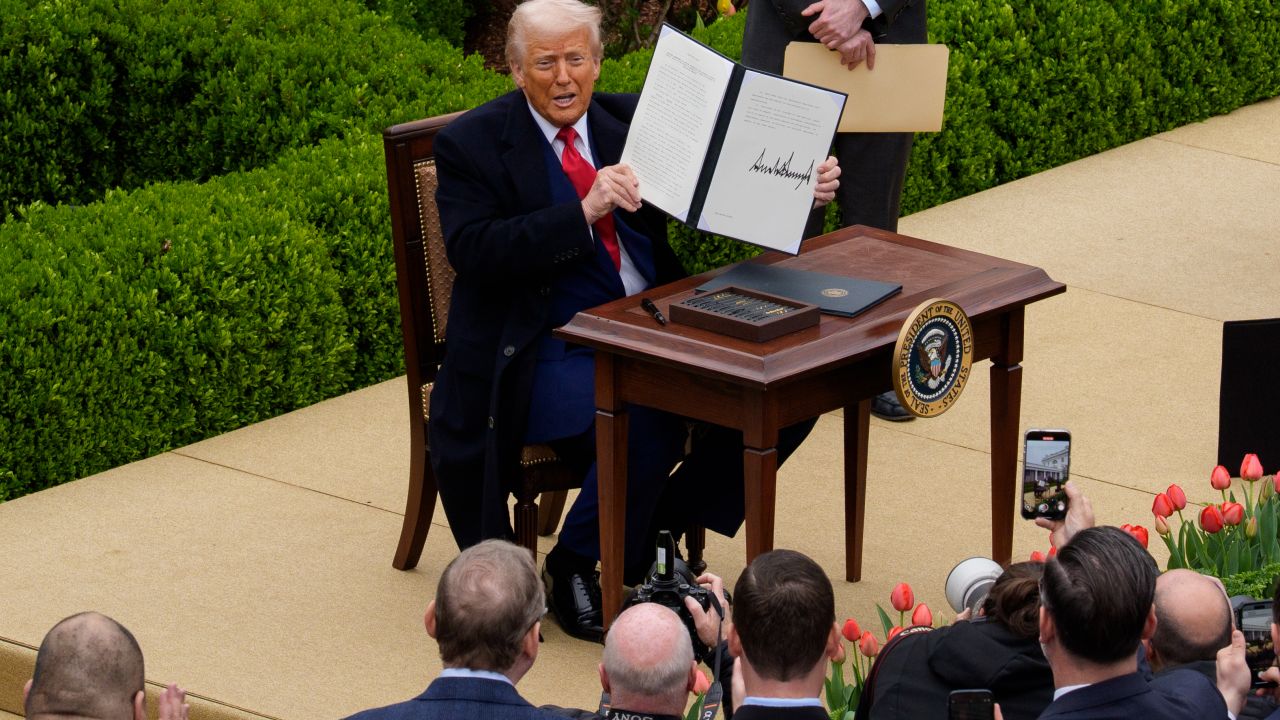 WASHINGTON, DC - APRIL 02: U.S. President Donald Trump signs an executive order imposing tariffs on imported goods during a "Make America Wealthy Again" trade announcement event in the Rose Garden at the White House on April 2, 2025 in Washington, DC. Touting the event as "Liberation Day", Trump announced sweeping new tariffs targeting goods imported to the U.S. on countries including China, Japan and India. (Photo by Andrew Harnik/Getty Images)