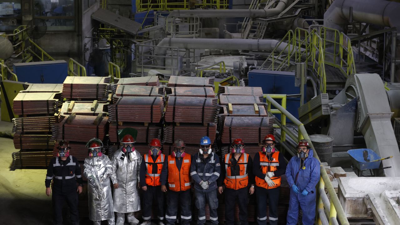 Miners pose in front of copper production at El Teniente mine, the world's largest underground copper mine in Machali, near Rancagua, Chile on April 2, 2025. (Photo by RAUL BRAVO / AFP) (Photo by RAUL BRAVO/AFP via Getty Images)          