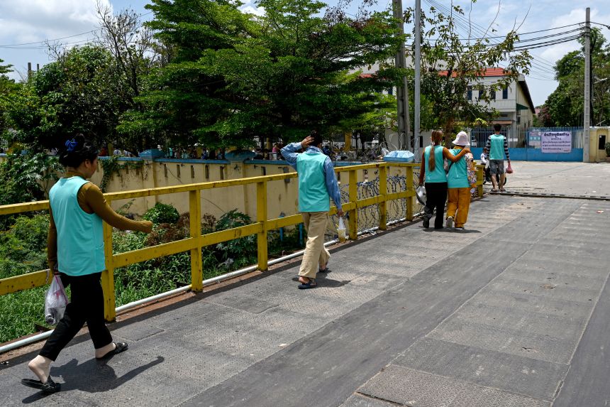 Garment workers walk back to their factory in Phnom Penh on April 3. Cambodia originally seemed a cost-effective alternative for US companies importing goods from China. But the Trump administration is now threatening higher tariffs on goods from Cambodia than those from China.