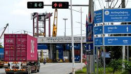 A truck transports a container near the entrance of the Phnom Penh Autonomous Port on April 3, 2025.