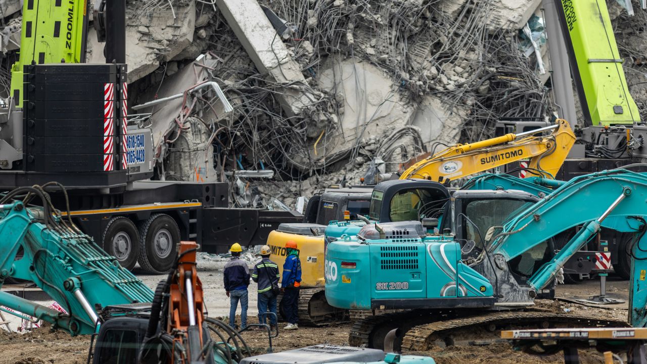 BANGKOK, THAILAND - MARCH 31: Thai rescue teams work to rescue and recover those trapped in the rubble of a collapsed construction building on March 31, 2025 in Bangkok, Thailand. Rescue efforts are ongoing at the collapsed State Audit Office building in Bangkok's Chatuchak district, where a 30-story structure crumbled following Friday's powerful 7.7-magnitude earthquake centered in Myanmar. The quake, which caused widespread destruction across Southeast Asia, has claimed at least 18 lives in Bangkok and over 1,600 in Myanmar, with dozens still missing under the rubble. Rescuers face significant challenges, including aftershocks and structural instability, as they race against time to locate survivors amidst the debris. (Photo by Lauren DeCicca/Getty Images)