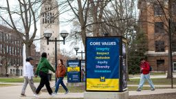 ANN ARBOR, MICHIGAN - APRIL 3: University of Michigan students walk on the UM campus next to signage displaying the University's "Core Values" on April 3, 2025 in  Ann Arbor, Michigan. Last week, the University stated it was closing its Office of Diversity, Equity and Inclusion, Office of Healthy Equity and Inclusion, and its DEI 2.0 Strategic Plan, all in response to President Donald Trump's Executive Orders concerning DEI. (Photo by Bill Pugliano/Getty Images)