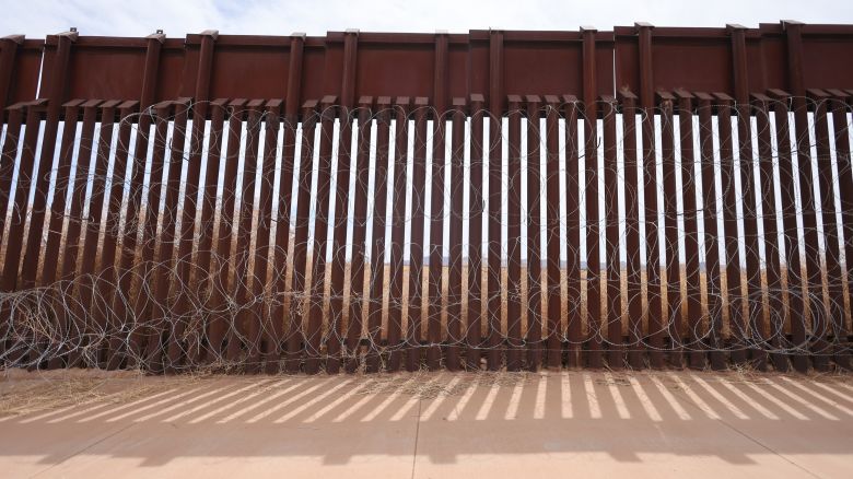 Wire is attached along the fence at the southern US border with Mexico in Douglas, Arizona, on April 3.