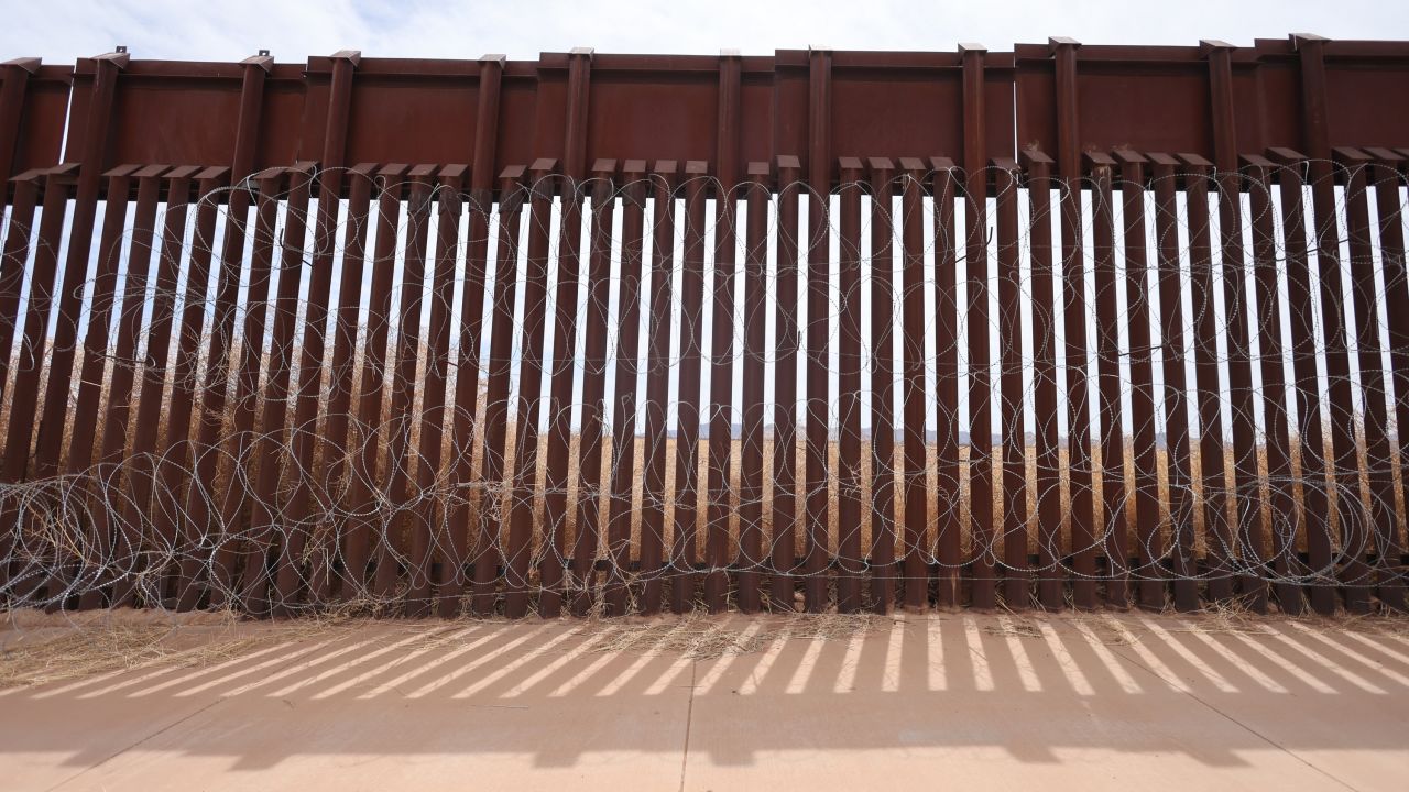 Wire is attached along the fence at the southern US border with Mexico in Douglas, Arizona, on April 3.