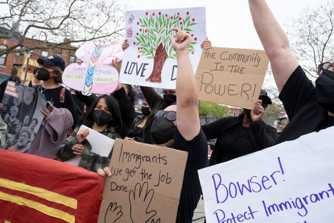 Demonstrators shout slogans and hold signs as they accuse DC leaders of not doing enough to protect the city's immigrant communities.