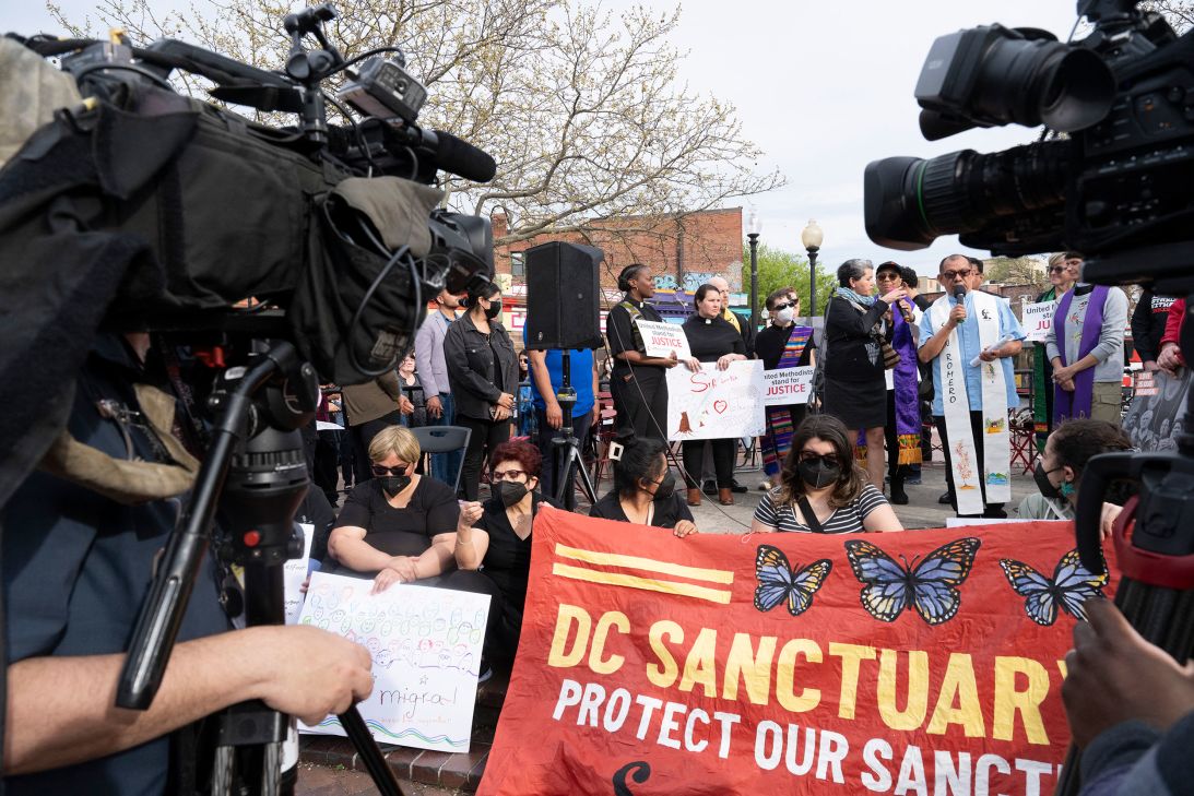 Protesters pushing for DC leaders to do more to protect the city's sanctuary status gather at a local park.