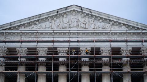 Workers erect scaffolding around the exterior of the U.S. Supreme Court building in Washington on Friday evening, April 4, 2025.