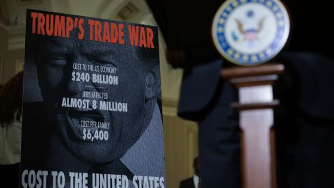 WASHINGTON, DC - APRIL 01: A sign on Trump's Trade War behind U.S. Tim Kaine (D-VA) while he speaks to reporters following the weekly Democratic Senate policy luncheon at the U.S. Capitol on April 01, 2025 in Washington, DC. Senators spoke about the White House's intended tariffs and taxes to be implemented.  (Photo by Kayla Bartkowski/Getty Images)