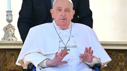 Pope Francis, seen with an oxygen breathing apparatus, gestures during a surprise appearance at the end of a mass for the sick and healthcare workers on St. Peter's square in The Vatican, on April 6, 2025. (Photo by Alberto PIZZOLI / AFP) (Photo by ALBERTO PIZZOLI/AFP via Getty Images)          