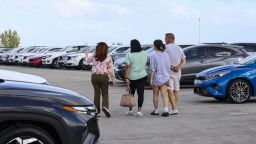 Customers view new vehicles displayed for sale at a Volkswagen AG (VW) dealership in Miami, Florida, US, on Saturday, April 5, 2025. Car buyers have been rushing to US showrooms to lock in deals before potential price hikes, and automakers are bracing for significant potential cost increases and supply-chain turmoil, with some companies planning to temporarily halt production or reduce overtime. Photographer: Eva Marie Uzcategui/Bloomberg via Getty Images