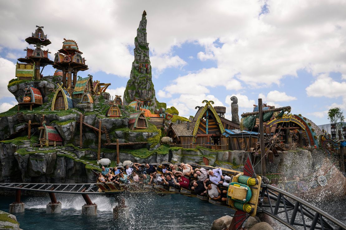Guests ride the Hiccup's Wing Gliders rollercoaster in the How to Train Your Dragon - Isle of Berk area, at Epic Universe theme park in Orlando, Florida on Saturday, April 5, 2025.