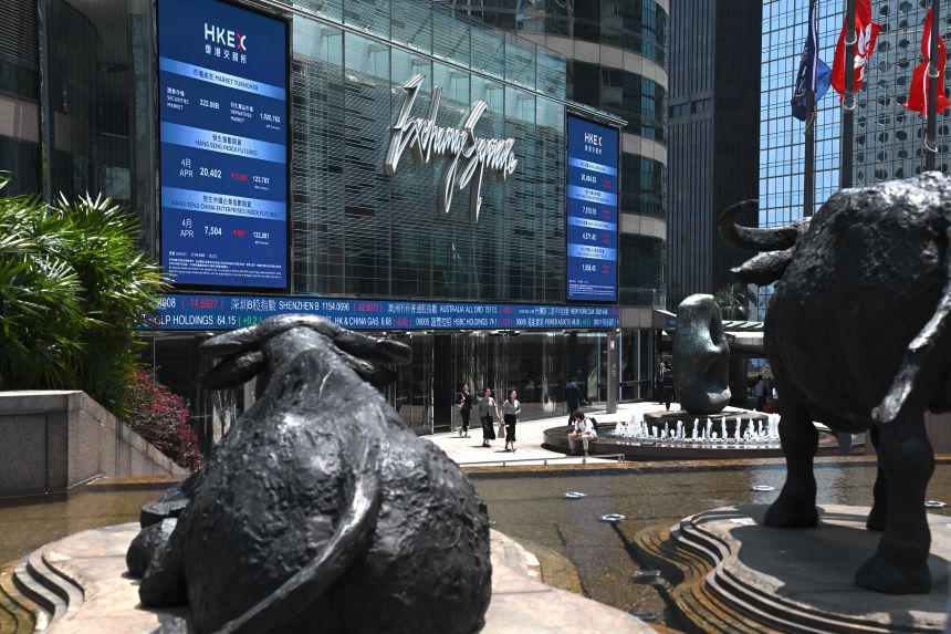 An electronic display board shows the Hang Seng Index at Exchange Square in Hong Kong on April 7, 2025.