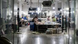 Workers at a garment workshop at Tangbudong Village at night in Guangzhou, Guangdong Province, China, on Monday, April 7, 2025. China pledged to retaliate against Donald Trump's latest tariff threat and stepped up efforts to support the market, raising the risk of a prolonged trade war between the world's two largest economies.
