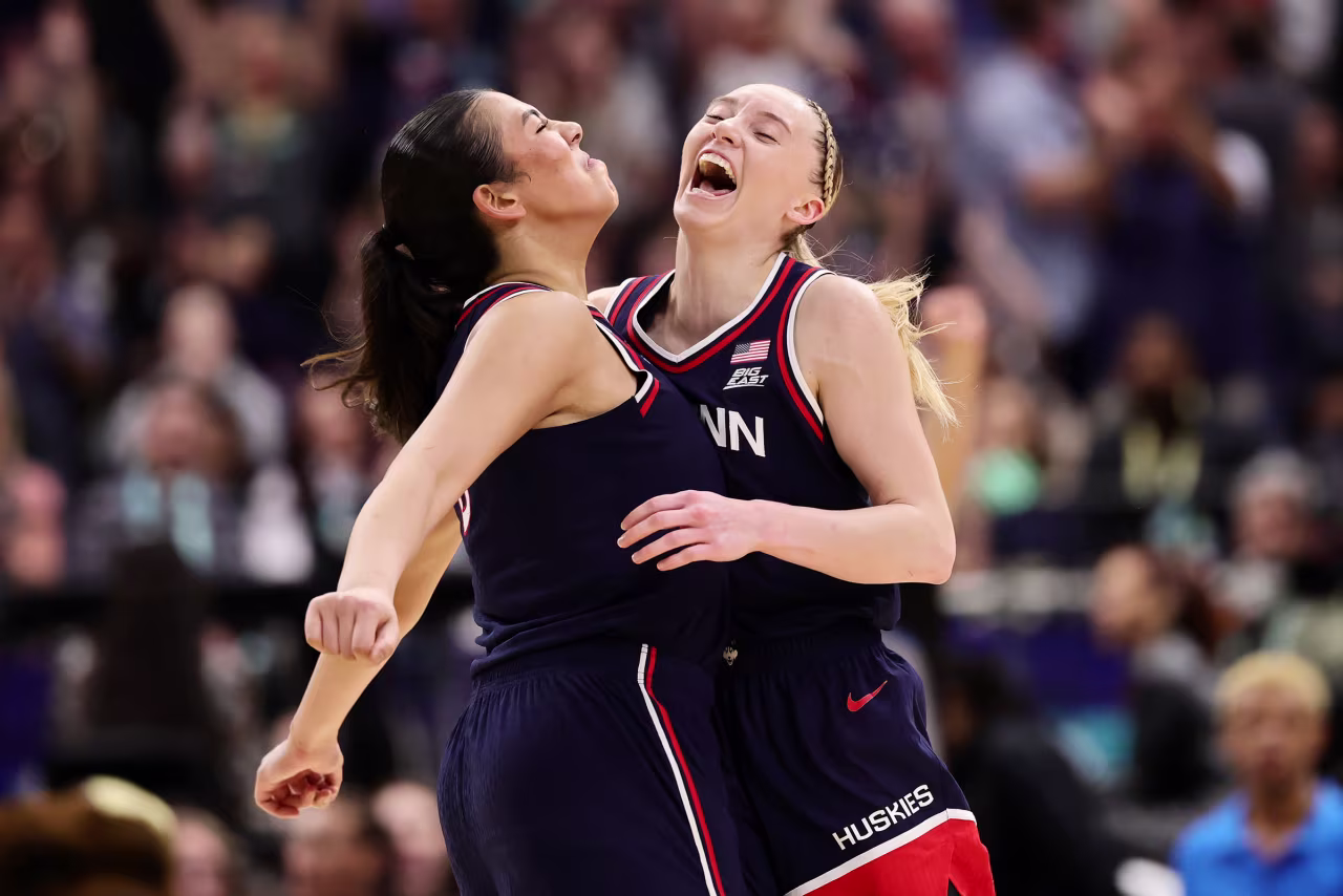Jana El Alfy and Paige Bueckers of the UConn Huskies celebrate after a play against UCLA.