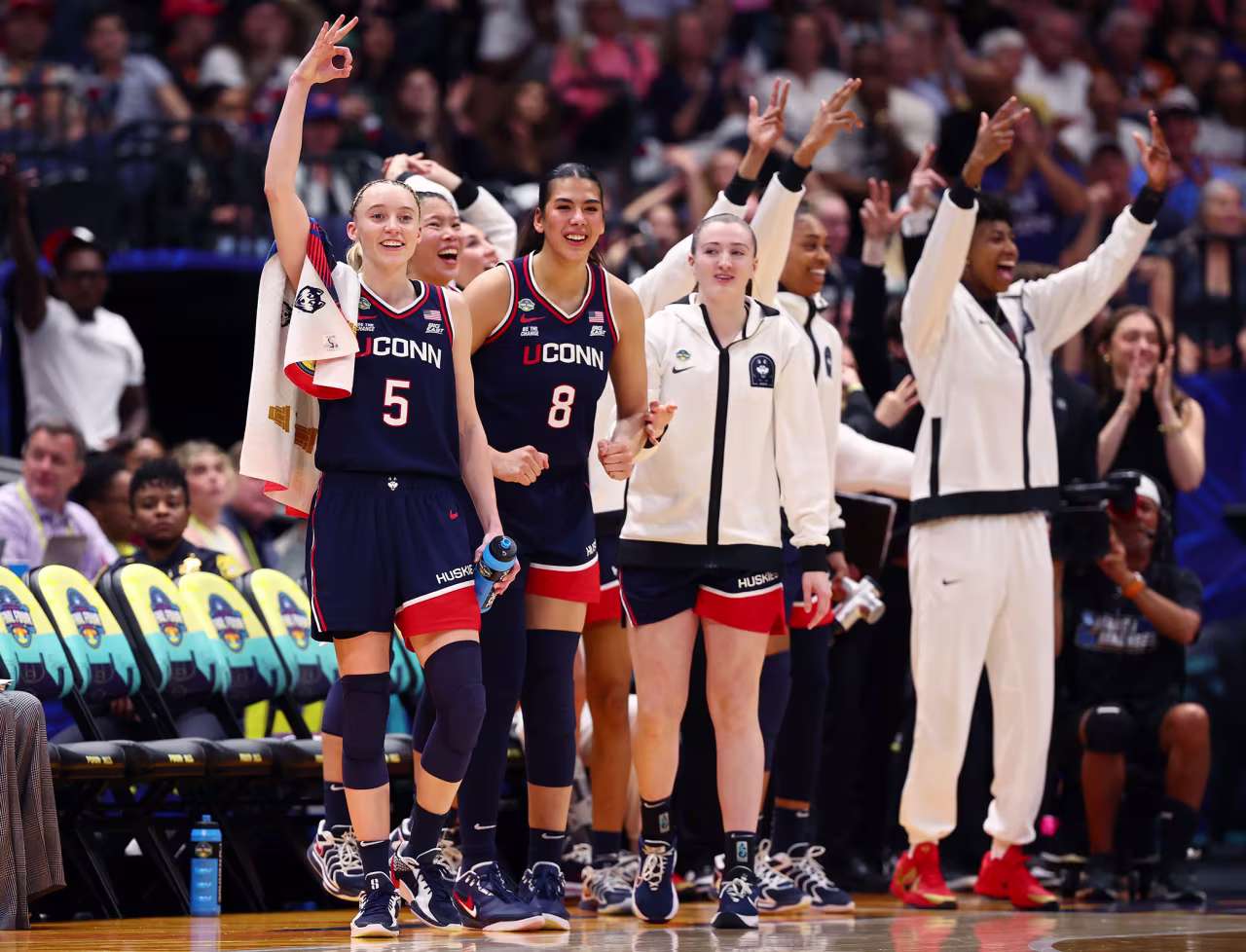 UConn's Paige Bueckers celebrates on the bench against UCLA.