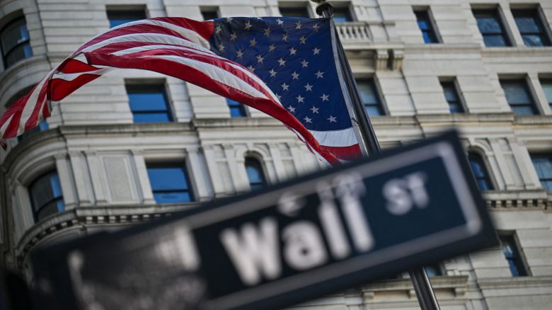An American flag flies near the New York Stock Exchange in New York's Financial District.