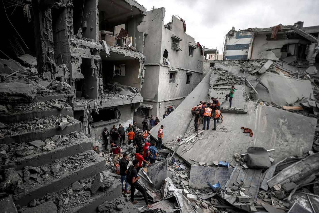 Rescue teams conduct a search operation following an Israeli airstrike on a residential area in Gaza City's Shujaiyye neighborhood on April 9, 2025.