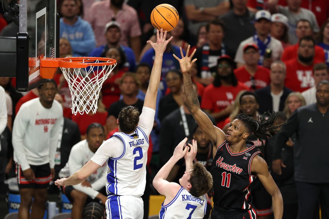 Flagg blocks the shot of Joseph Tugler of the Houston Cougars during the second half of their Final Four game.