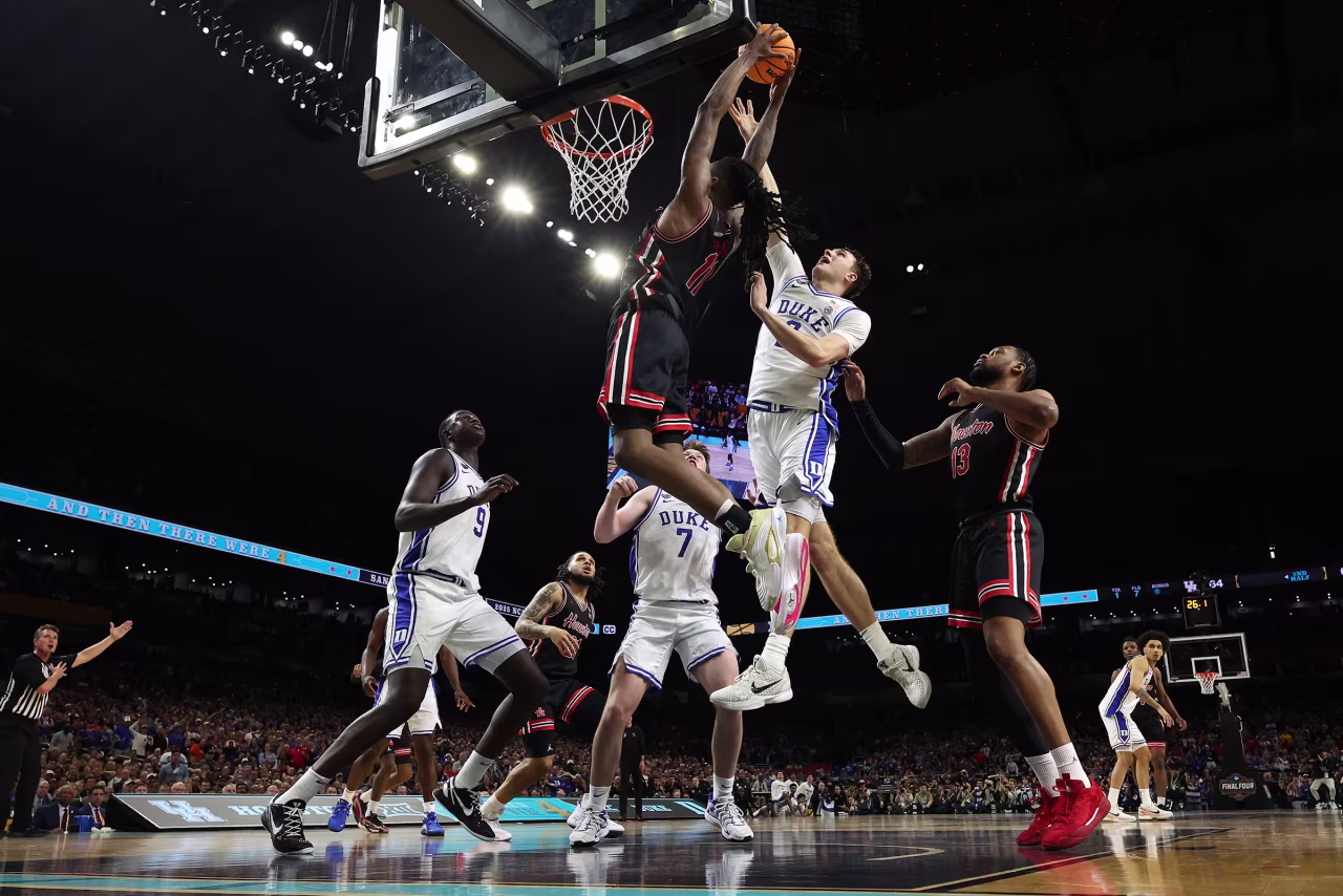 Houston forward Joseph Tugler dunks the ball against over Duke's Cooper Flagg.