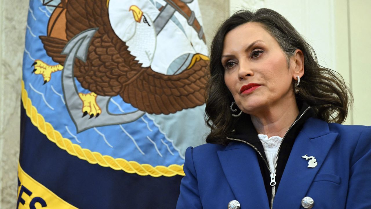 Michigan Governor Gretchen Whitmer looks on as US President Donald Trump signs an executive order in the Oval Office of the White House on April 9, 2025 in Washington, DC.