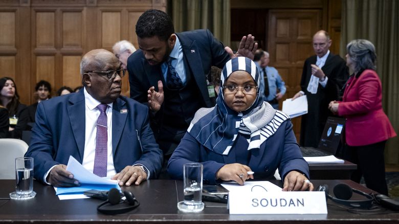 Muawia Osman Mohamed Khair (L), Sudan's acting Minister of Justice, and Sudanese ambassador to the Netherlands Omaima Alsharief wait for the start of a hearing before the International Court of Justice in The Hague, on Thursday.