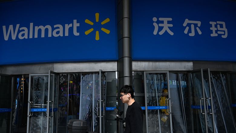 A man walks past a Walmart supermarket in Beijing on April 10, 2025.