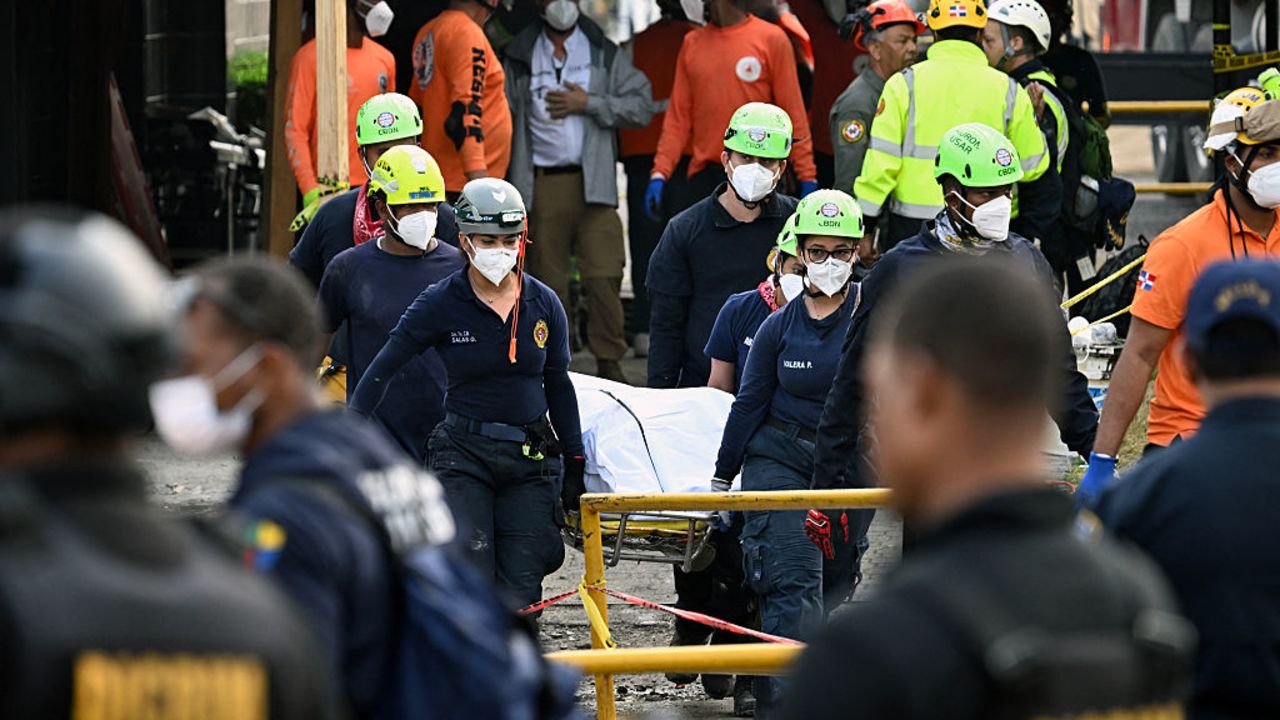 Rescuers carry the body of a victim at the Jet Set nightclub -which roof collapsed two days ago- in Santo Domingo on April 10, 2025. The death toll in the collapse has reached 218, security forces reported, as they concentrate on finding the last bodies in the area of the tragedy. More than 500 people were injured in the incident. (Photo by MARTIN BERNETTI / AFP) (Photo by MARTIN BERNETTI/AFP via Getty Images)          