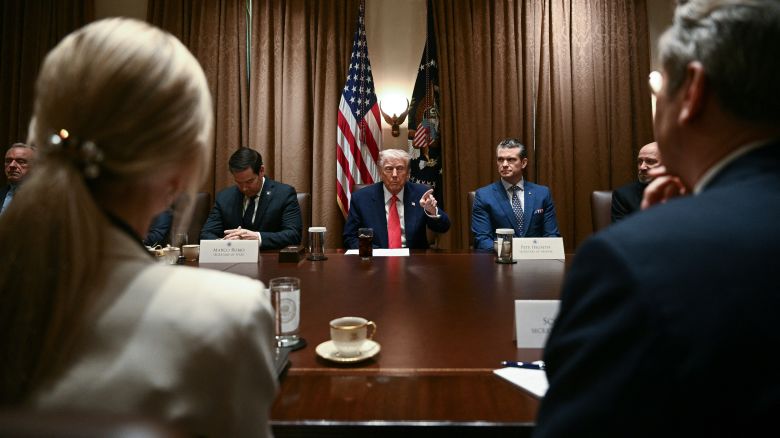 TOPSHOT - US President Donald Trump speaks during a cabinet meeting in the Cabinet Room of the White House on April 10, 2025, in Washington, DC. Also pictured, L-R, Secretary of Health and Human Services Robert F. Kennedy Jr., Secretary of State Marco Rubio, Secretary of Defense Pete Hegseth, Secretary of Commerce Howard Lutnick and Secretary of Treasury Scott Bessent. Trump on Thursday warned of the "transition cost" from his tariff policies, as Wall Street stocks fell again over the worsening trade war with China. (Photo by Brendan SMIALOWSKI / AFP) (Photo by BRENDAN SMIALOWSKI/AFP via Getty Images)          