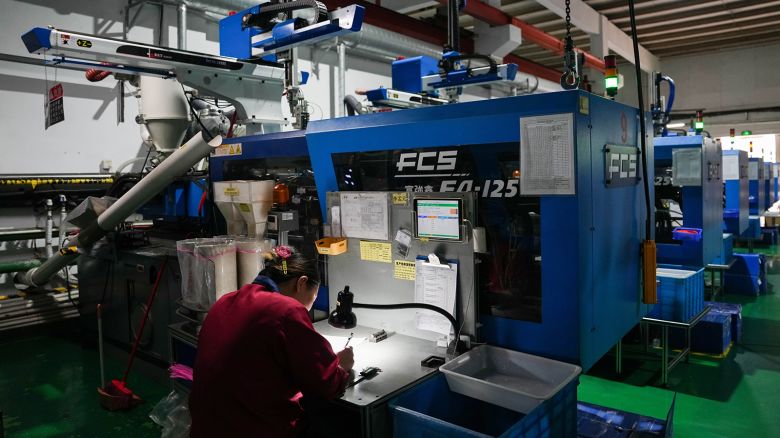 A staff member works at the production line of a communication connector company in Beilun District of Ningbo City, east China's Zhejiang Province, April 9, 2025.