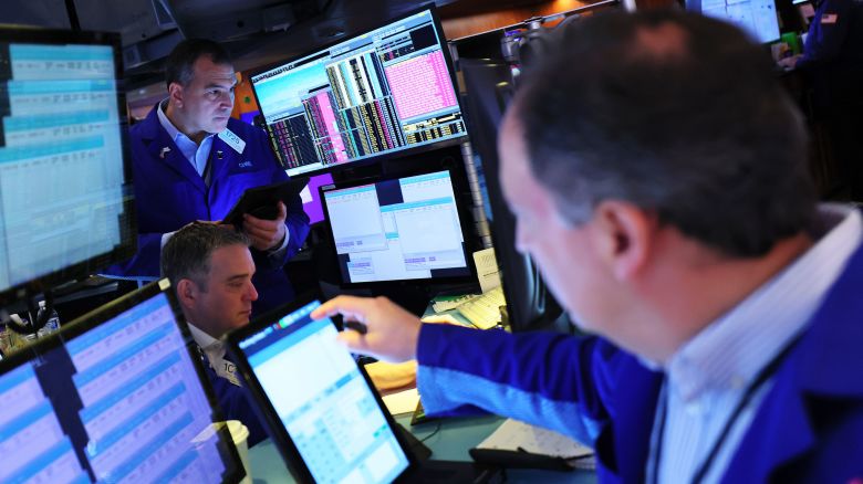 Traders work on the floor of the New York Stock Exchange during morning trading on April 7, 2025, in New York. All three major stock indexes dipped again at the opening of the stock market for the third straight day with the Dow Jones dropping over 1000 points and the S & P 500 nearing bear market territory amid U.S. President Donald Trump's sweeping new tariffs and other countries' retaliations.