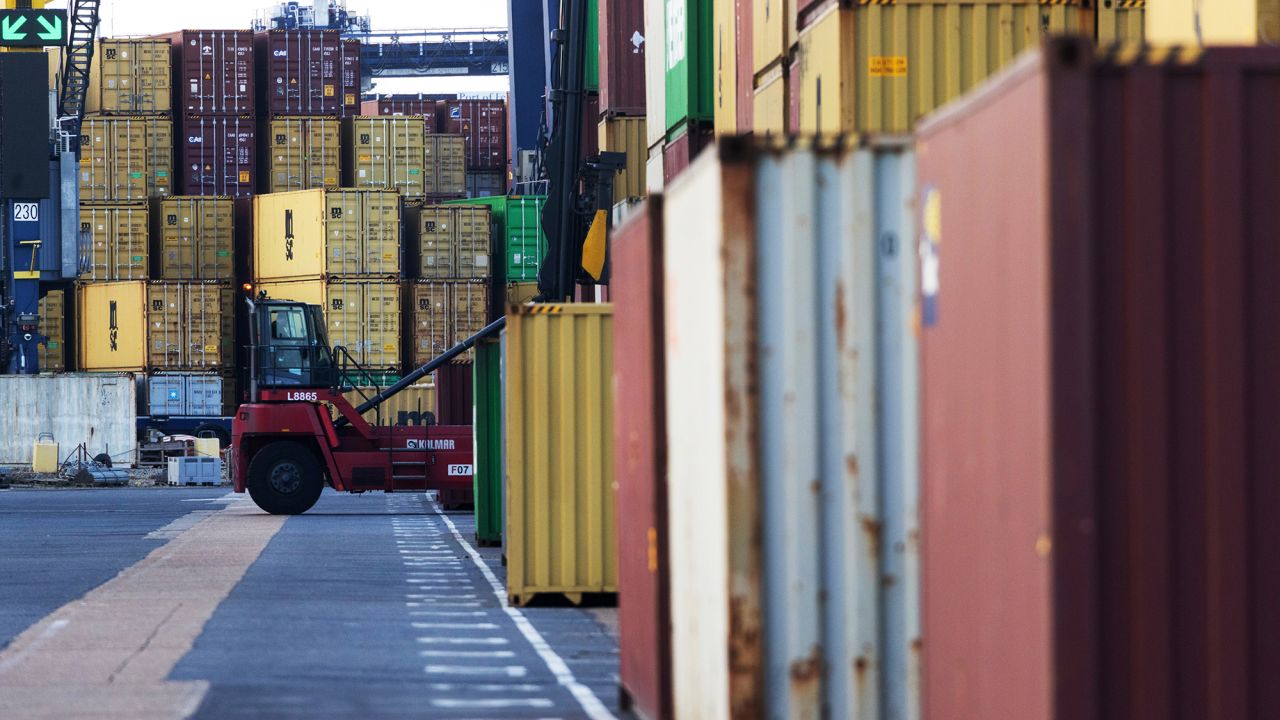 A worker moves a shipping container at Felixstowe port in Felixstowe, UK, on Wednesday, April 9, 2025.