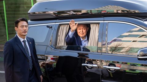Ousted former President Yoon Suk-yeol waves to supporters while leaving the official residence in Hannam-dong for his private home in Seocho-dong in Seoul, South Korea, on April 11, 2025. (Photo by Chris Jung/NurPhoto via Getty Images)