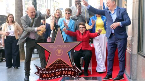 HOLLYWOOD, CALIFORNIA - APRIL 07: (L-R) Ana Martinez, Hollywood Walk of Fame Producer, Steven Nissen, President & CEO, Hollywood Chamber of Commerce, Ellen K, Ilana Kloss, Magic Johnson, Billie Jean King and Jamie Lee Curtis attend the Hollywood Walk of Fame Star Ceremony Honoring American Tennis Player Billie Jean King on April 07, 2025 in Hollywood, California. (Photo by Kevin Winter/Getty Images)