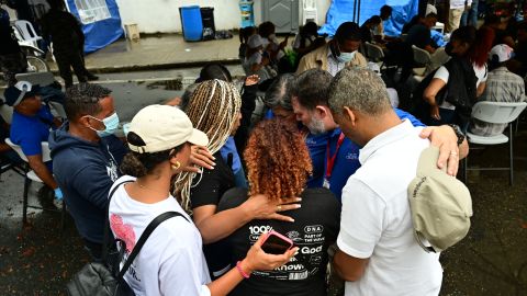 People wait for the bodies of their relatives at the Forensic National Institute morgue after the Jet Set nightclub roof collapsed in Santo Domingo on April 11, 2025. Grief-stricken Dominicans began holding funerals for loved ones who were among at least 220 people killed in a nightclub rooftop collapse, even as dozens remained uned for. (Photo by MARTIN BERNETTI / AFP) (Photo by MARTIN BERNETTI/AFP via Getty Images)          