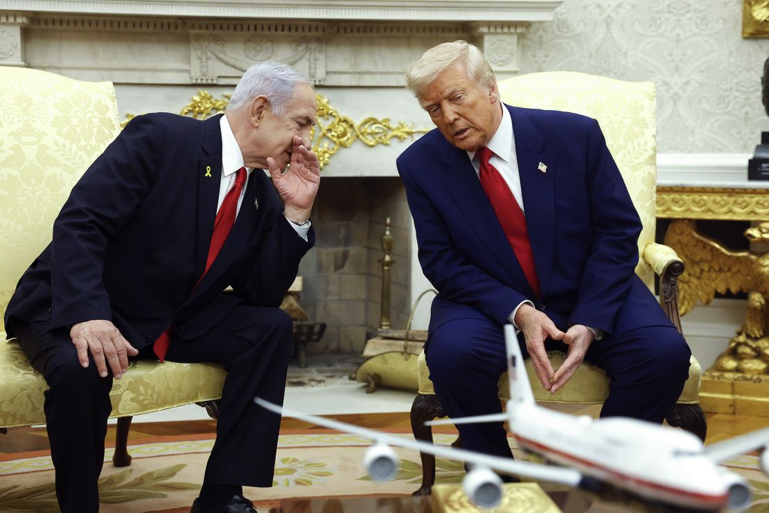 Israel's Prime Minister Benjamin Netanyahu talks to US President Donald Trump during a meeting in the Oval Office on April 7, 2025.
