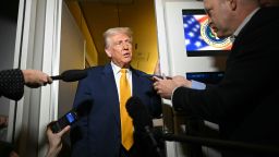 US President Donald Trump speaks to reporters during the flight from Palm Beach to Miami aboard Air Force One on April 12, 2025. Trump is heading to Miami to attend UFC Fight 314.