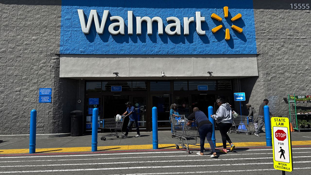 Customers enter a Walmart store on April 9, 2025, in San Leandro, California.