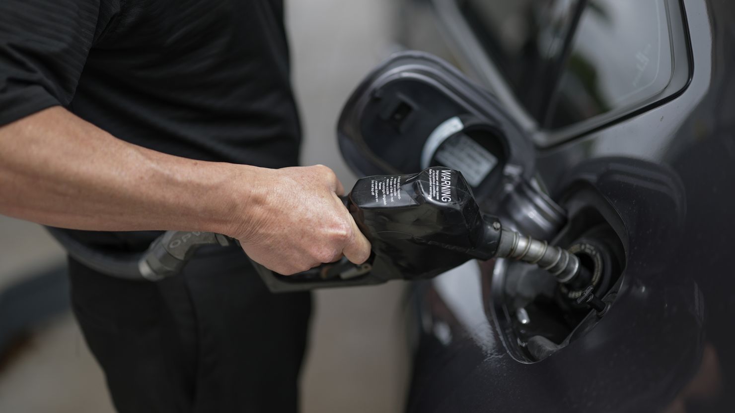 A customer pumps gas into their vehicle at a Shell station on April 10 in Miami, Florida.