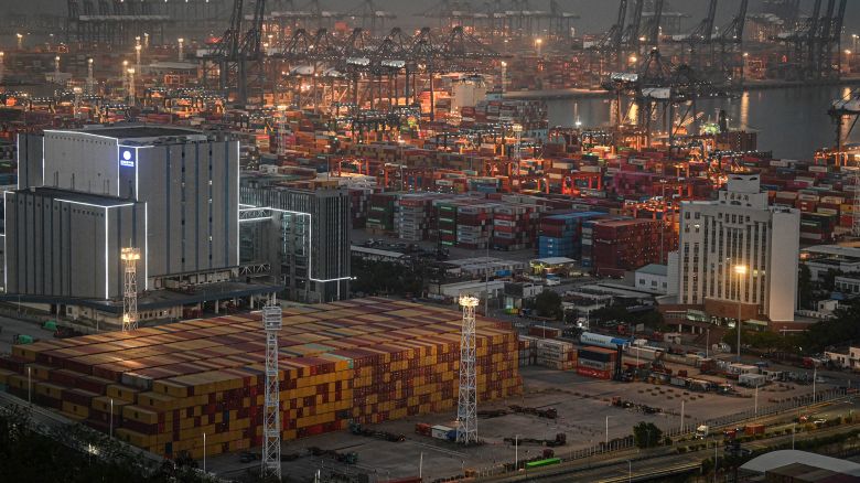 Shipping containers and gantry cranes are seen at the Yantian port at night in Shenzhen, in southern China's Guangdong province on April 14, 2025. Markets on April 14 welcomed a US tariffs reprieve for electronics, but President Donald Trump warned no country would get "off the hook" in his trade war -- especially China. (Photo by JADE GAO / AFP) (Photo by JADE GAO/AFP via Getty Images)          