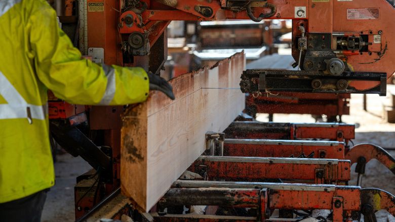 A worker cuts lumber at a saw mill near Sooke, British Columbia, Canada, on Friday, April 11, 2025.