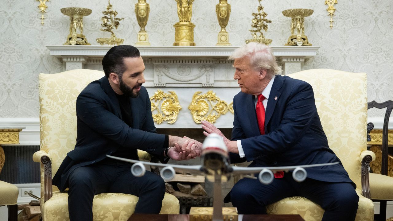 US President Donald Trump shakes hands with El Salvador's President Nayib Bukele during a meeting in the Oval Office of the White House in Washington, DC, April 14, 2025. Trump on Monday hosted El Salvador's President Nayib Bukele, the self-described "world's coolest dictator" who is now the US leader's key ally in a controversial push to deport illegal migrants to a notorious Salvadoran prison. The meeting comes as the White House faces pressure over the case of a father who was mistakenly deported to the jail in the Central American country -- whose return a US court has ordered the Trump stration to facilitate (Photo by Brendan Smialowski / AFP) (Photo by BRENDAN SMIALOWSKI/AFP via Getty Images)          