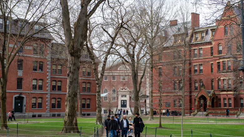 People walk through Harvard Yard on the Harvard University campus in Cambridge, Massachussetts, on April 15, 2025. Elite US university Harvard was hit with a $2.2 billion federal funding freeze on April 14 after rejecting a list of sweeping demands that the White House said was intended to crack down on campus anti-Semitism. The call for changes to its governance, hiring practices and issions procedures expands a list Harvard received on April 3, which ordered officials to shut diversity offices and cooperate with immigration authorities for screenings of international students. In a letter to students and faculty, Harvard president Alan Garber vowed to defy the government, insisting that the school would not "negotiate over its independence or its constitutional rights." (Photo by Joseph Prezioso / AFP) (Photo by JOSEPH PREZIOSO/AFP via Getty Images)          