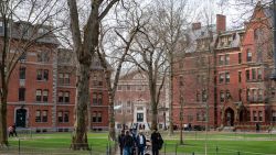 People walk through Harvard Yard on the Harvard University campus in Cambridge, Massachussetts, on April 15, 2025. Elite US university Harvard was hit with a $2.2 billion federal funding freeze on April 14 after rejecting a list of sweeping demands that the White House said was intended to crack down on campus anti-Semitism. The call for changes to its governance, hiring practices and issions procedures expands a list Harvard received on April 3, which ordered officials to shut diversity offices and cooperate with immigration authorities for screenings of international students. In a letter to students and faculty, Harvard president Alan Garber vowed to defy the government, insisting that the school would not "negotiate over its independence or its constitutional rights." (Photo by Joseph Prezioso / AFP) (Photo by JOSEPH PREZIOSO/AFP via Getty Images)
