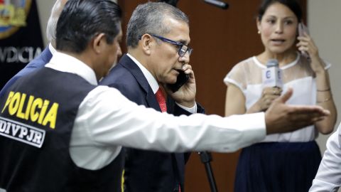 TOPSHOT - Peru's former President (2011-2016), Ollanta Humala, speaks on the phone as he leaves his sentence hearing at a court in Lima on April 15, 2025. A Peruvian court on Tuesday sentenced ex-president Ollanta Humala to 15 years in prison in a vast corruption case involving Brazilian construction group Odebrecht and bribes paid to politicians. (Photo by CONNIE  / AFP) (Photo by CONNIE /AFP via Getty Images)          