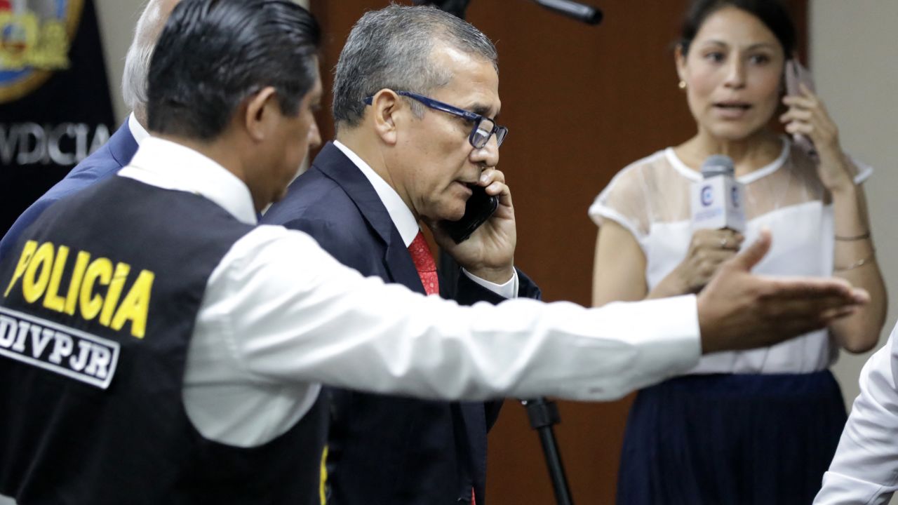TOPSHOT - Peru's former President (2011-2016), Ollanta Humala, speaks on the phone as he leaves his sentence hearing at a court in Lima on April 15, 2025. A Peruvian court on Tuesday sentenced ex-president Ollanta Humala to 15 years in prison in a vast corruption case involving Brazilian construction group Odebrecht and bribes paid to politicians. (Photo by CONNIE  / AFP) (Photo by CONNIE /AFP via Getty Images)          