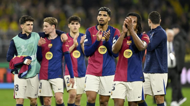 TOPSHOT - Barcelona's players celebrate after the end of the UEFA Champions League quarter-final second leg football match between BVB Borussia Dortmund and FC Barcelona in Dortmund, western Germany on April 15, 2025. Barcelona qualified for the Champions League semi-finals 5-3 on aggregate, despite losing Tuesday's second leg tie 3-1 at Borussia Dortmund. (Photo by INA FASSBENDER / AFP) (Photo by INA FASSBENDER/AFP via Getty Images)          