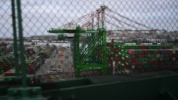 Cranes unload cargo shipping containers at the Port of Los Angeles in San Pedro, California, on April 15. Gross domestic product likely slowed due to higher imports driven by Americans rushing to beat Trump’s tariffs.
